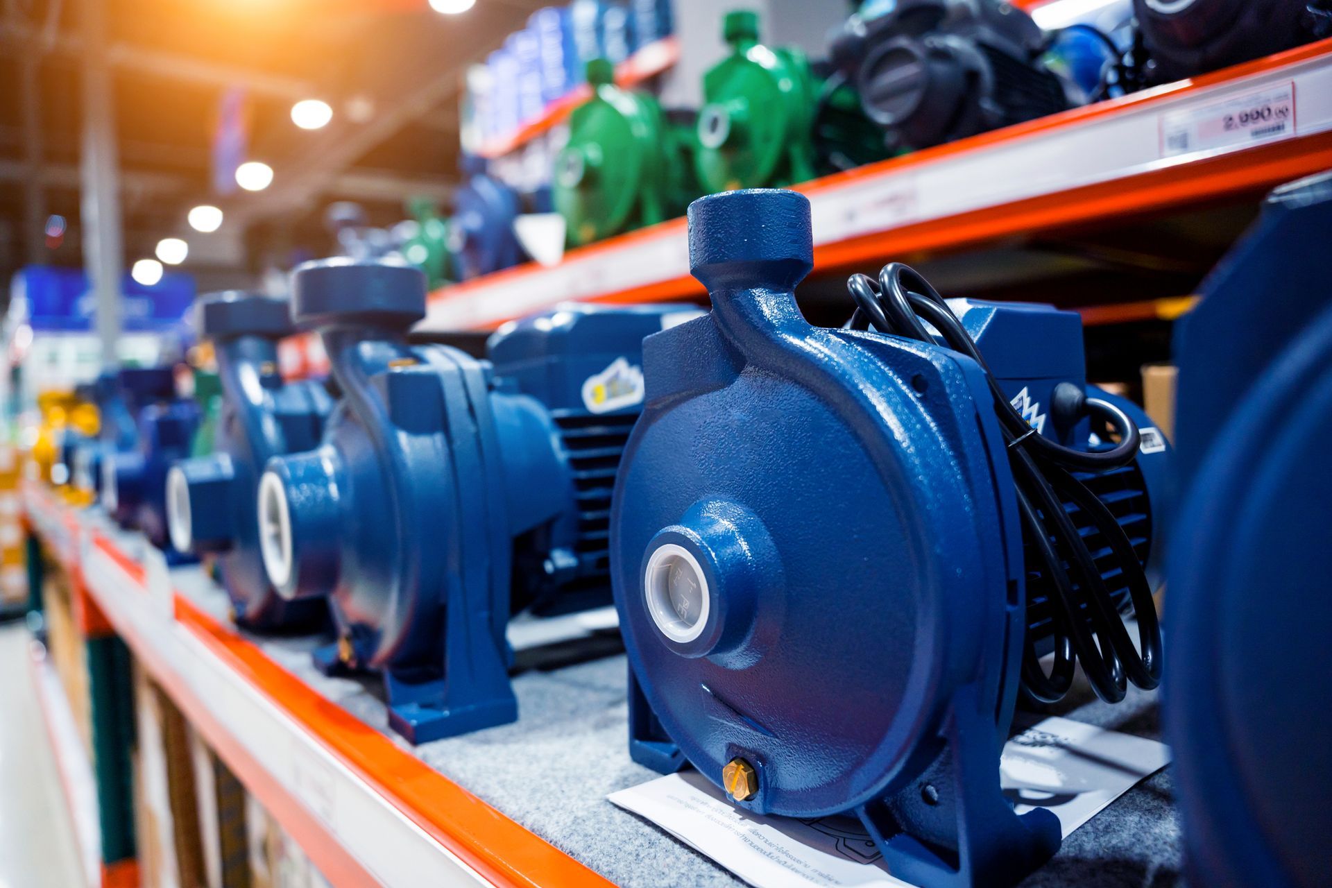 Industrial water pump with electric motor displayed in store, from a trusted water pump supplier.