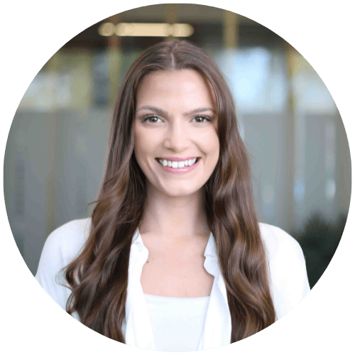 A woman with long brown hair is smiling in a circle.