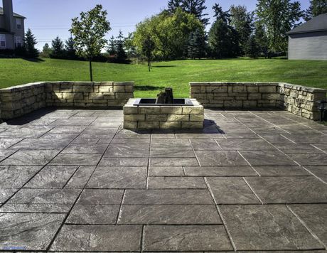 Stamped Concrete Patio with Stone Walls and Firepit
