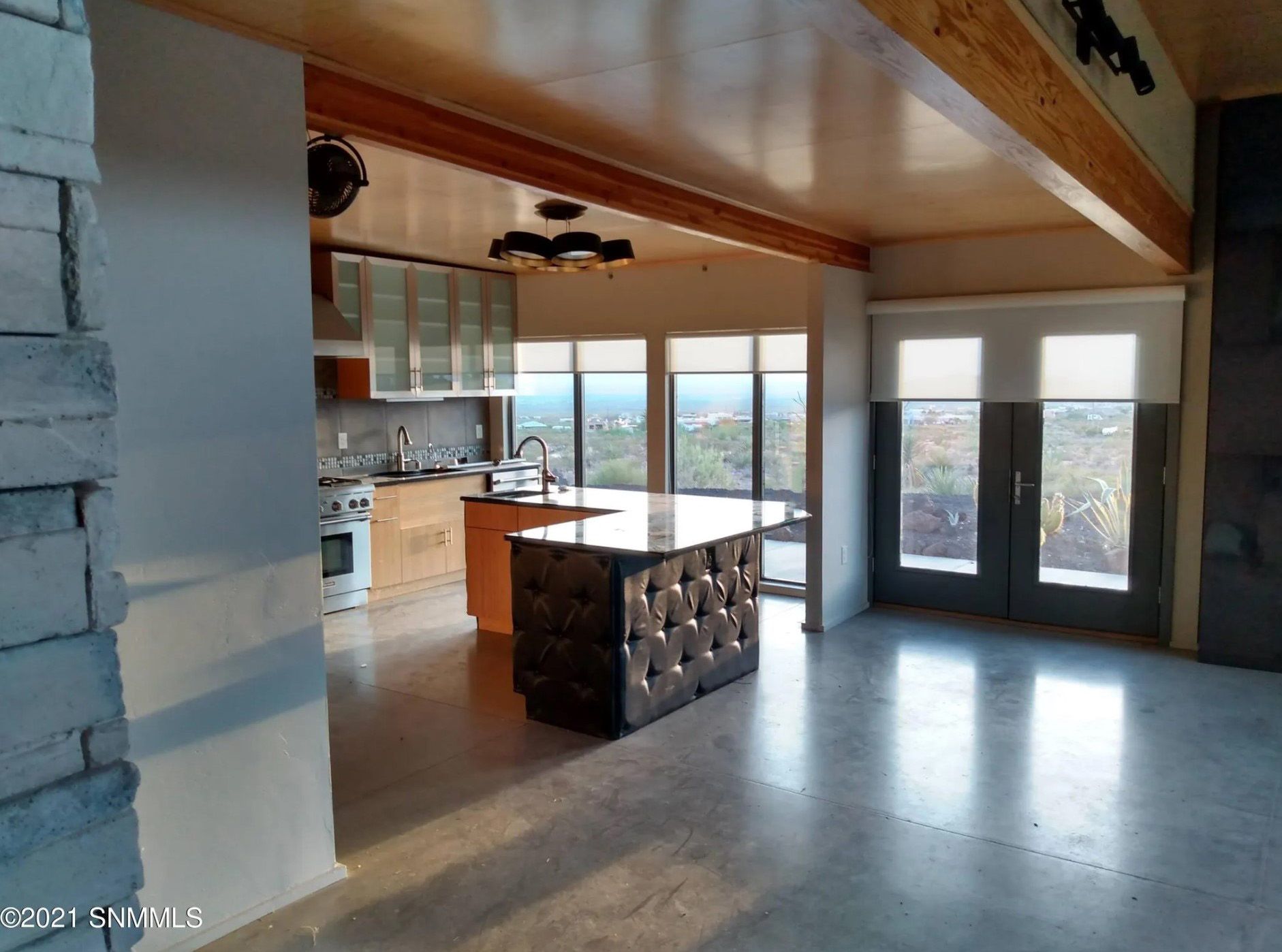 There is a large island in the middle of the room.