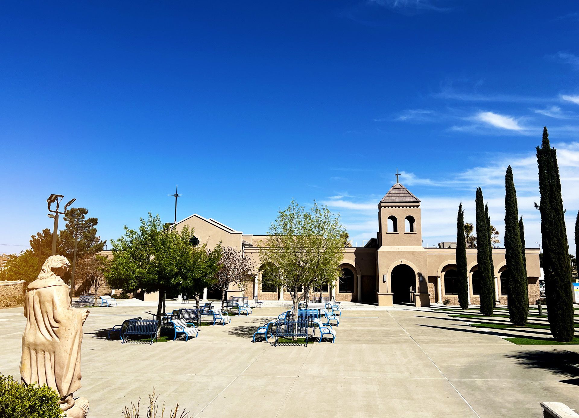 A large building with a statue in front of it