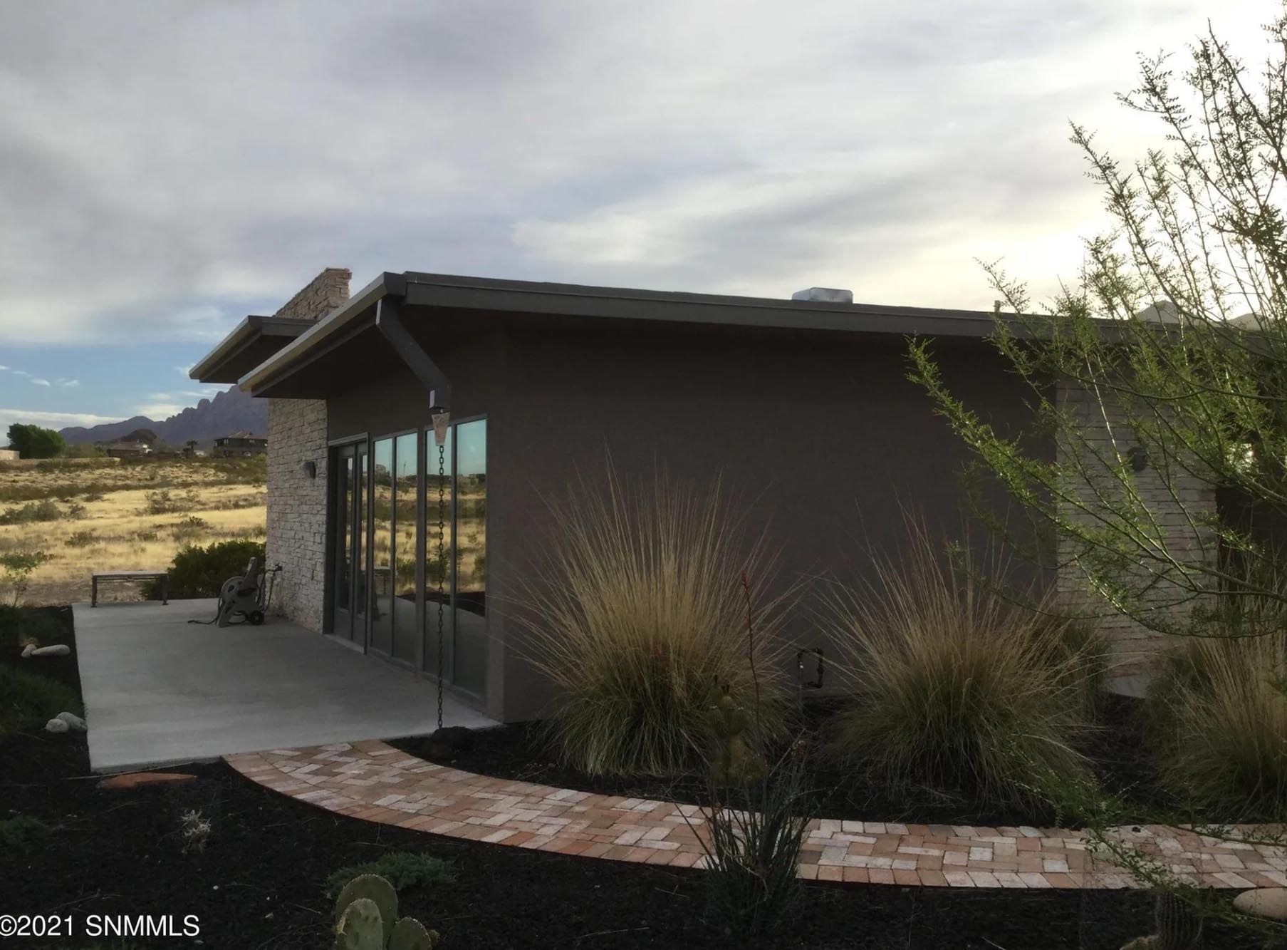 A house with a brick walkway leading to it