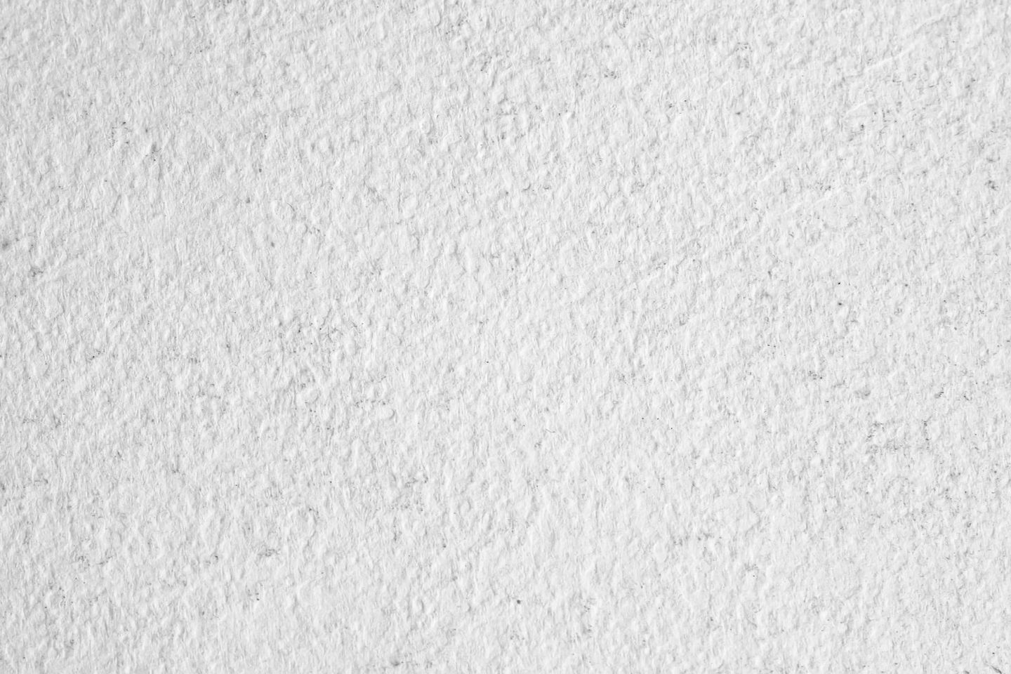 A close up of a white paper texture.