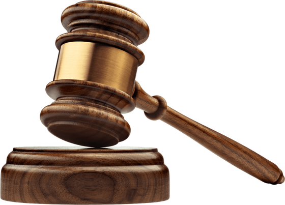 A wooden judge 's gavel is sitting on a wooden base