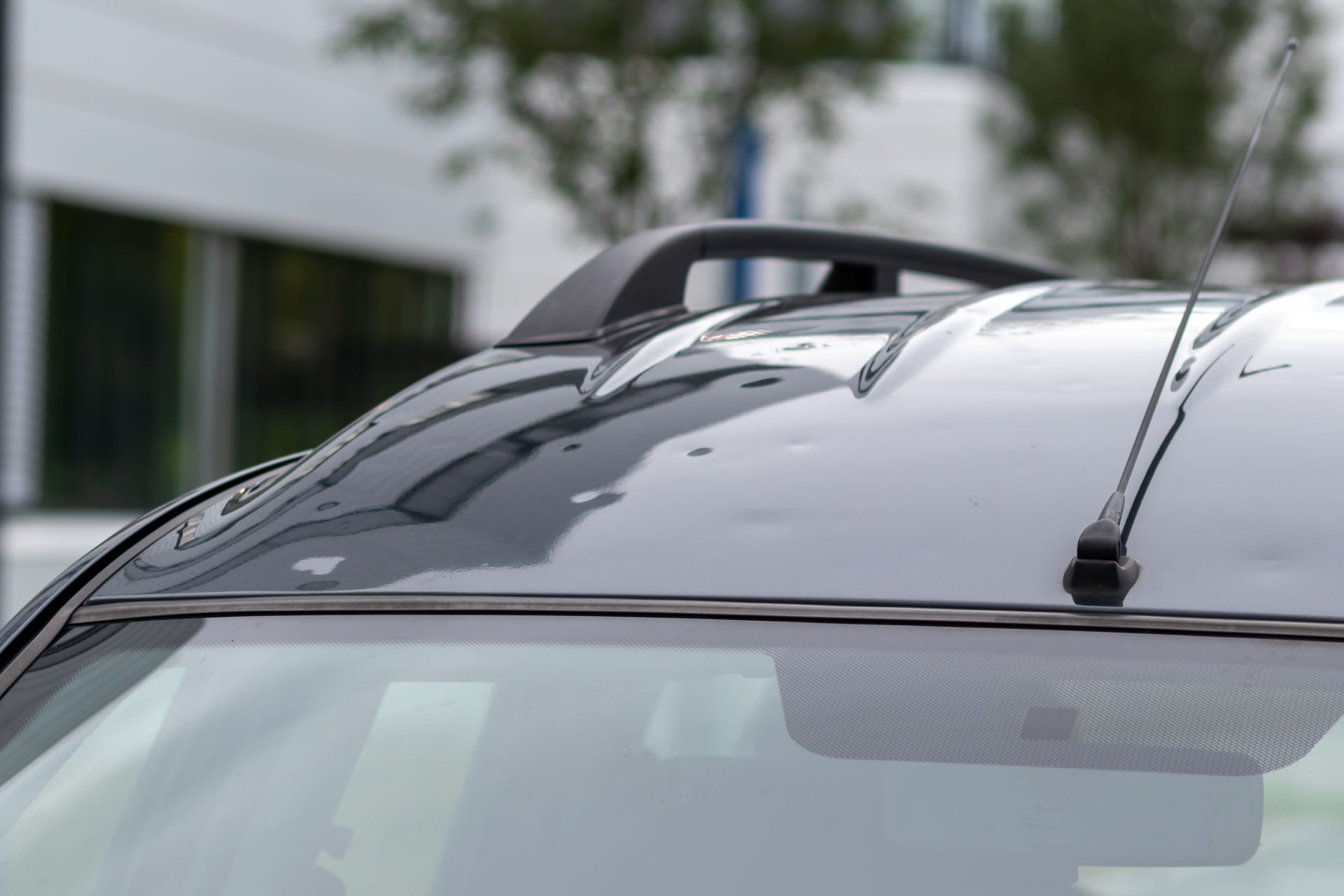 Vehicle's roof showing subtle damage from small hail impacts.