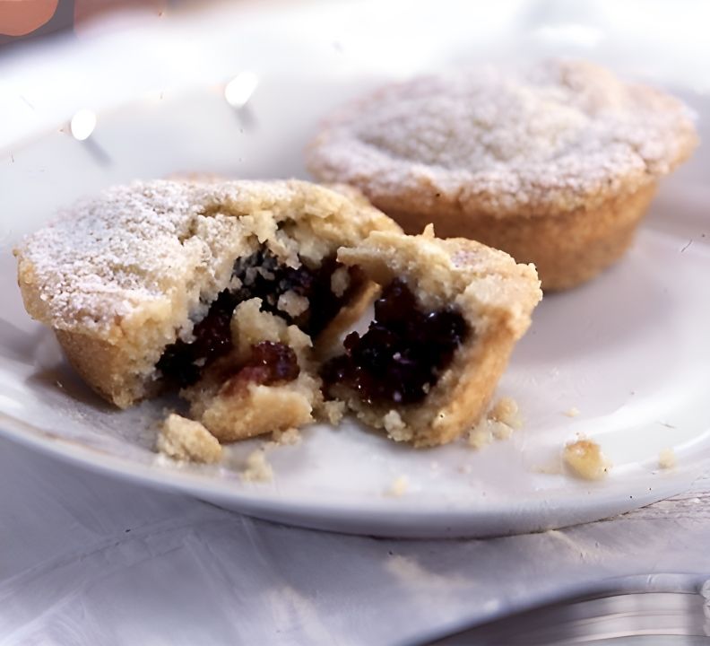 A White Plate Topped With Two Pies One of Which Has Been Cut in Half — Lismore Pie Cart in Lismore, NSW