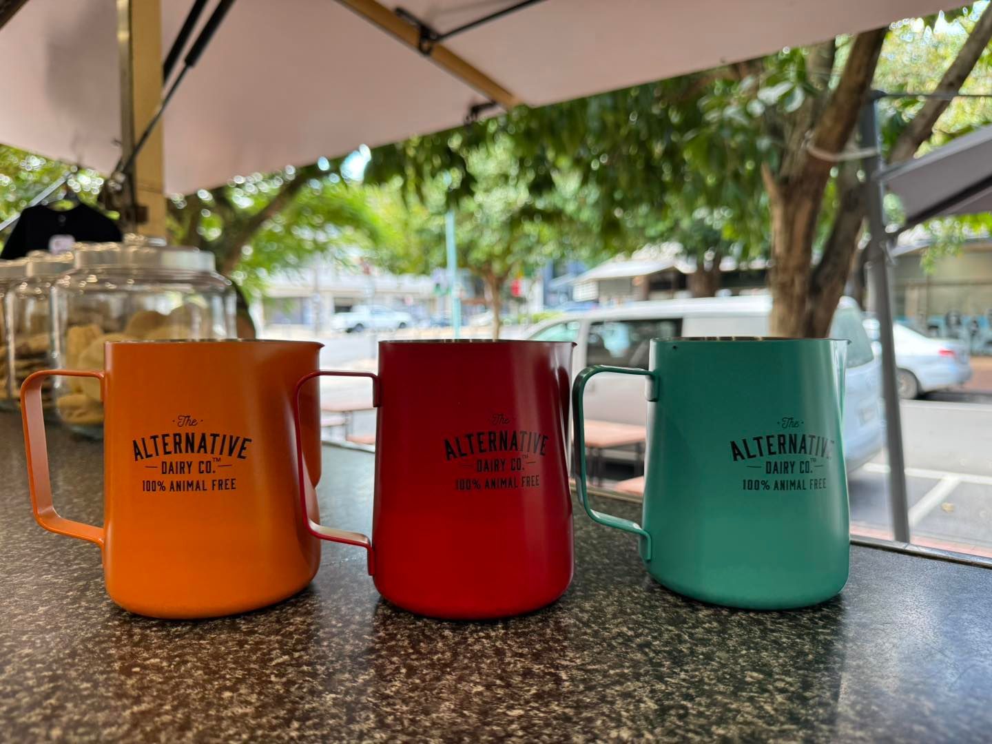 Three Pitchers of Different Colors Are Sitting on a Counter — Lismore Pie Cart in Lismore, NSW