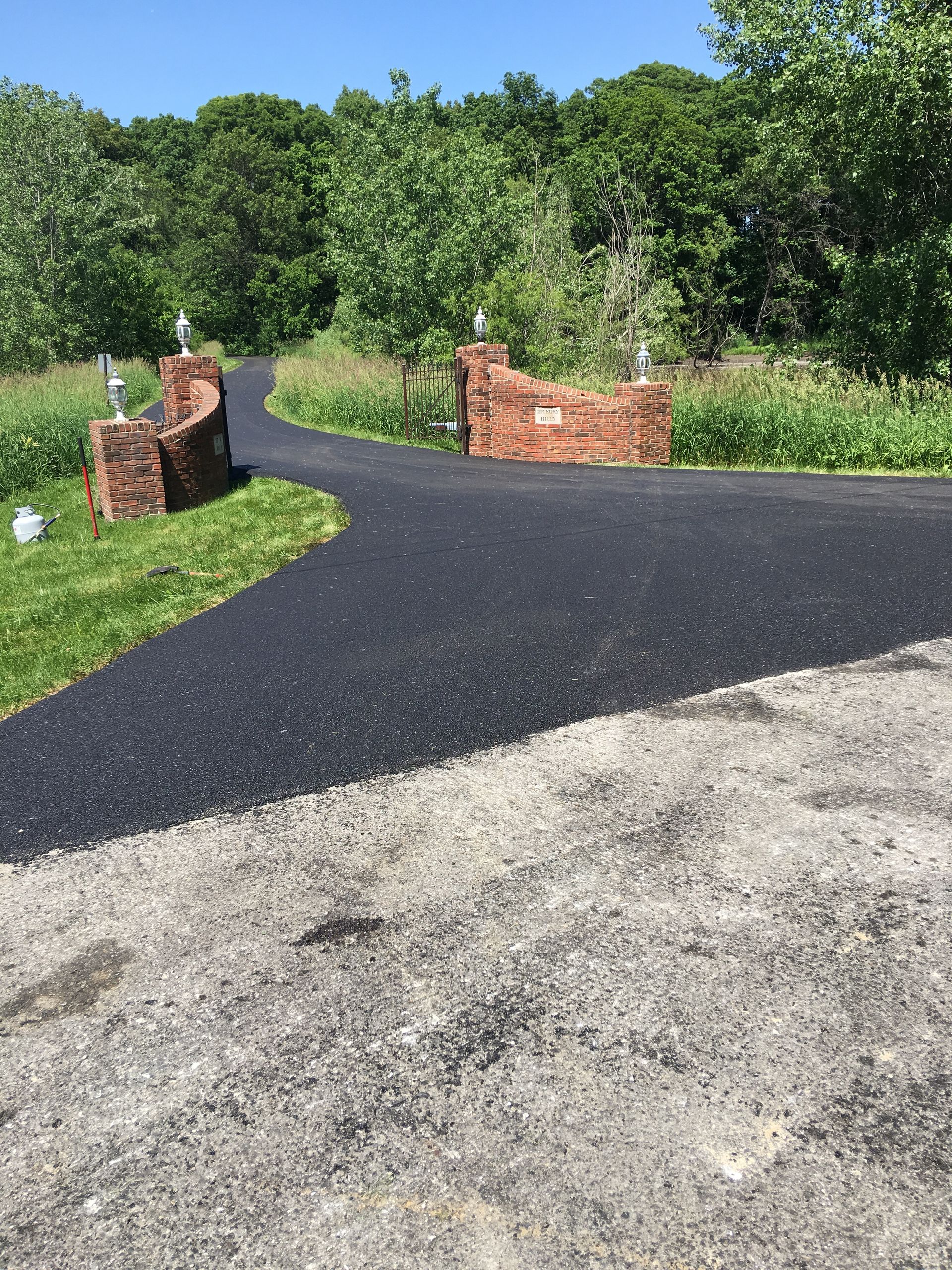A white house with purple shutters and a garage