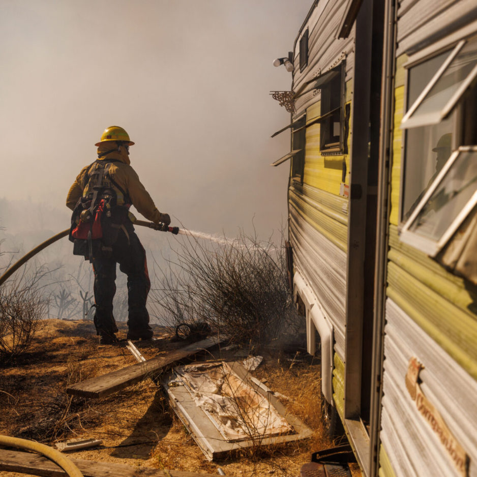 California firefighter putting out a house fire