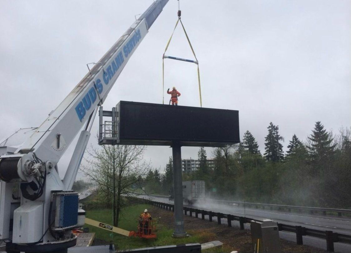 A crane lifting a container — Oregon City, OR  — Bud's Crane Service Inc