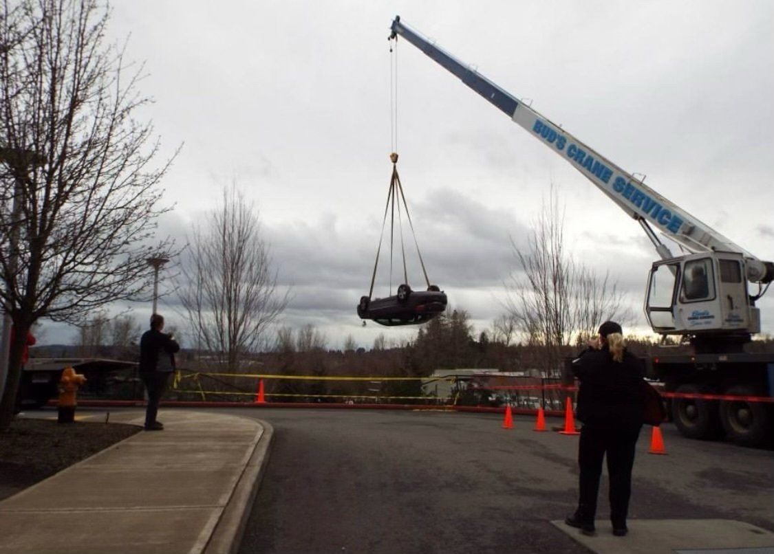 A crane lifting a car — Oregon City, OR  — Bud's Crane Service Inc