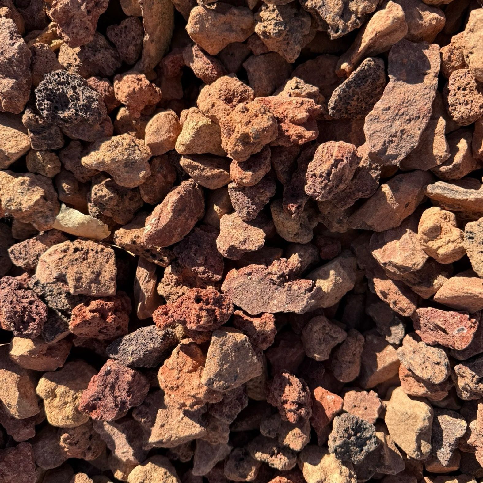 A pile of rocks that are brown and black