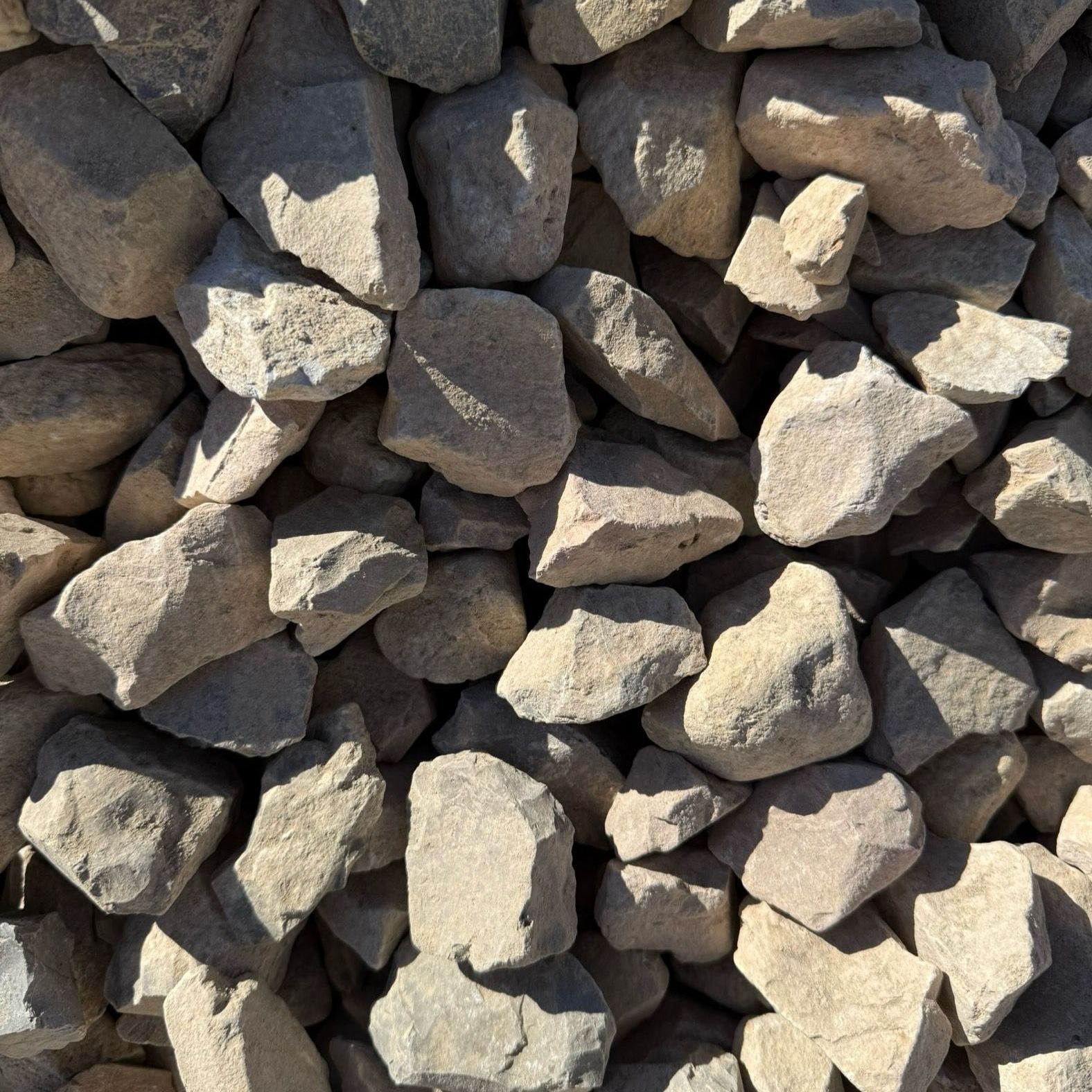 A pile of rocks is sitting on the ground