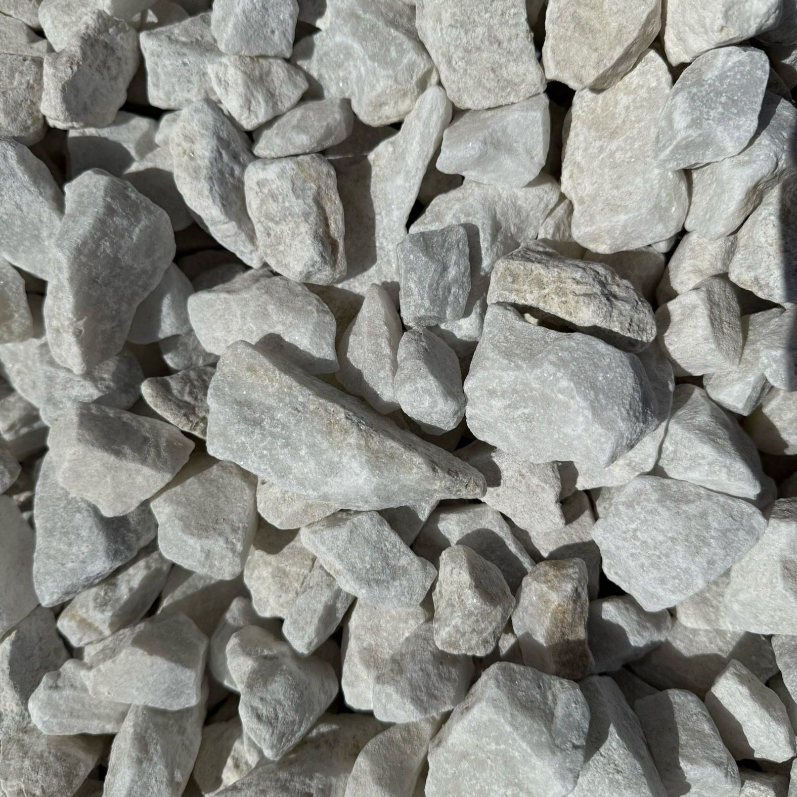A pile of white gravel is sitting on the ground