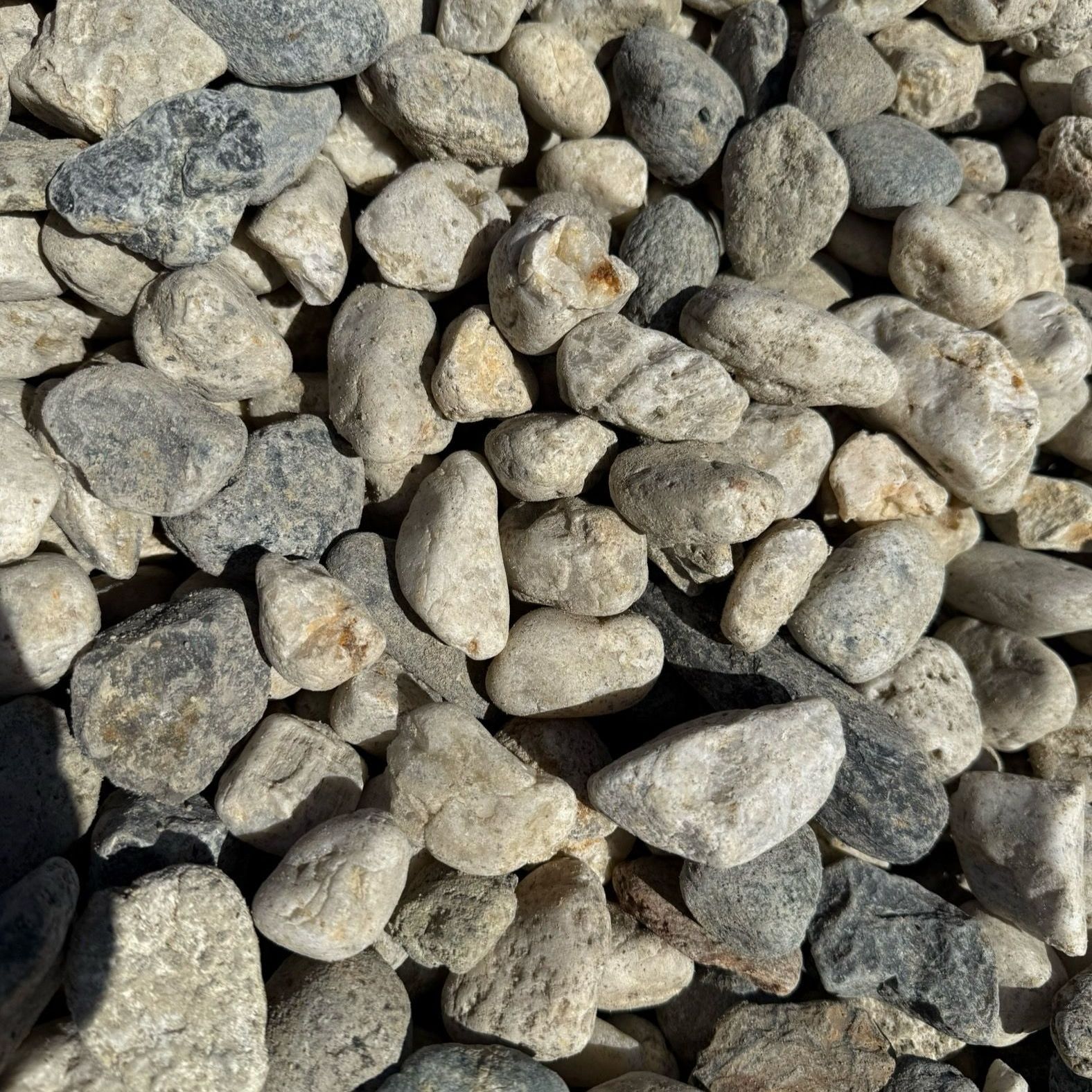 A pile of gravel is sitting on the ground