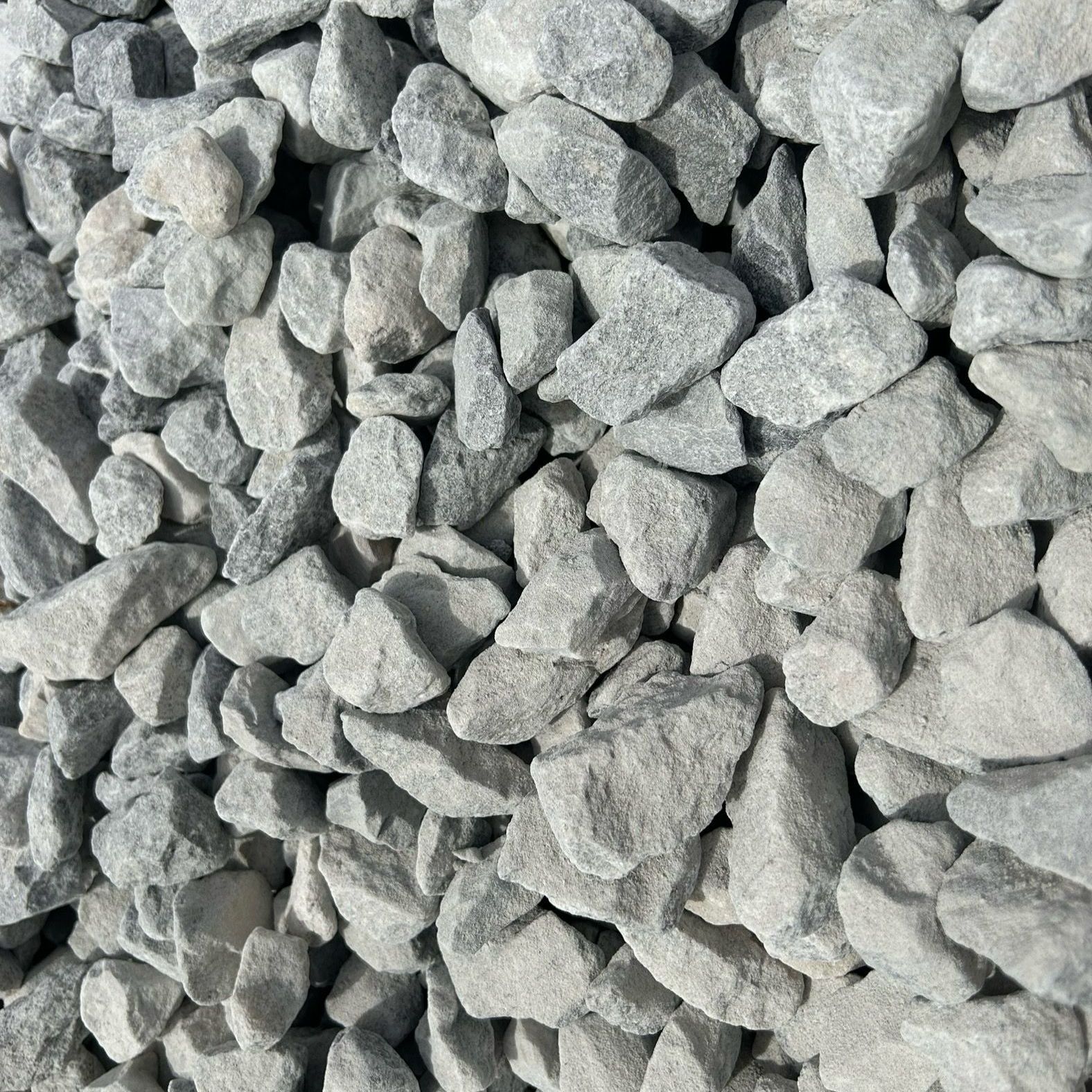 A pile of gravel is sitting on the ground.