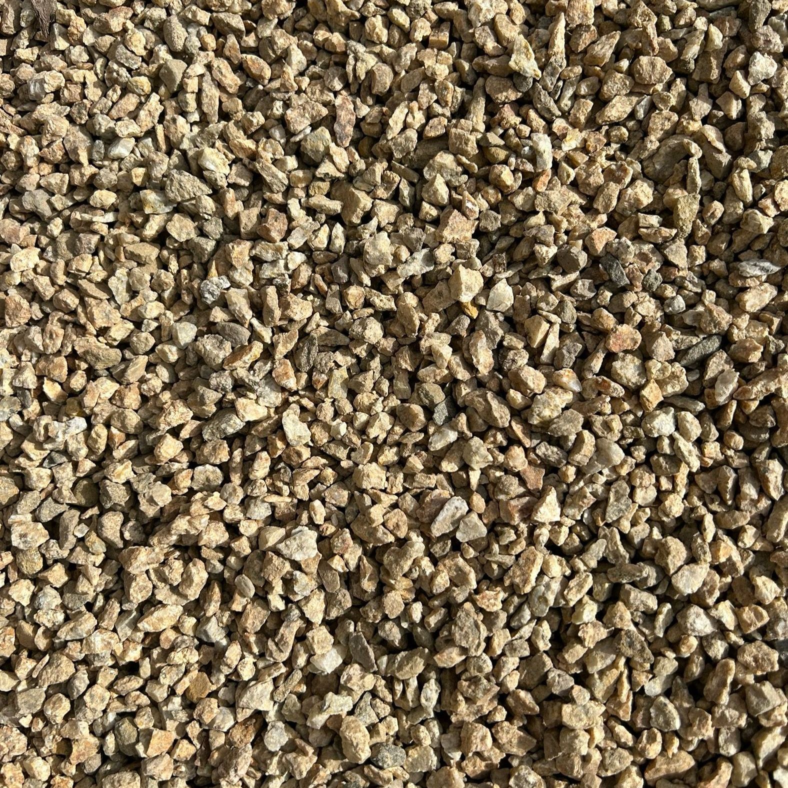 A pile of gravel is sitting on the ground.