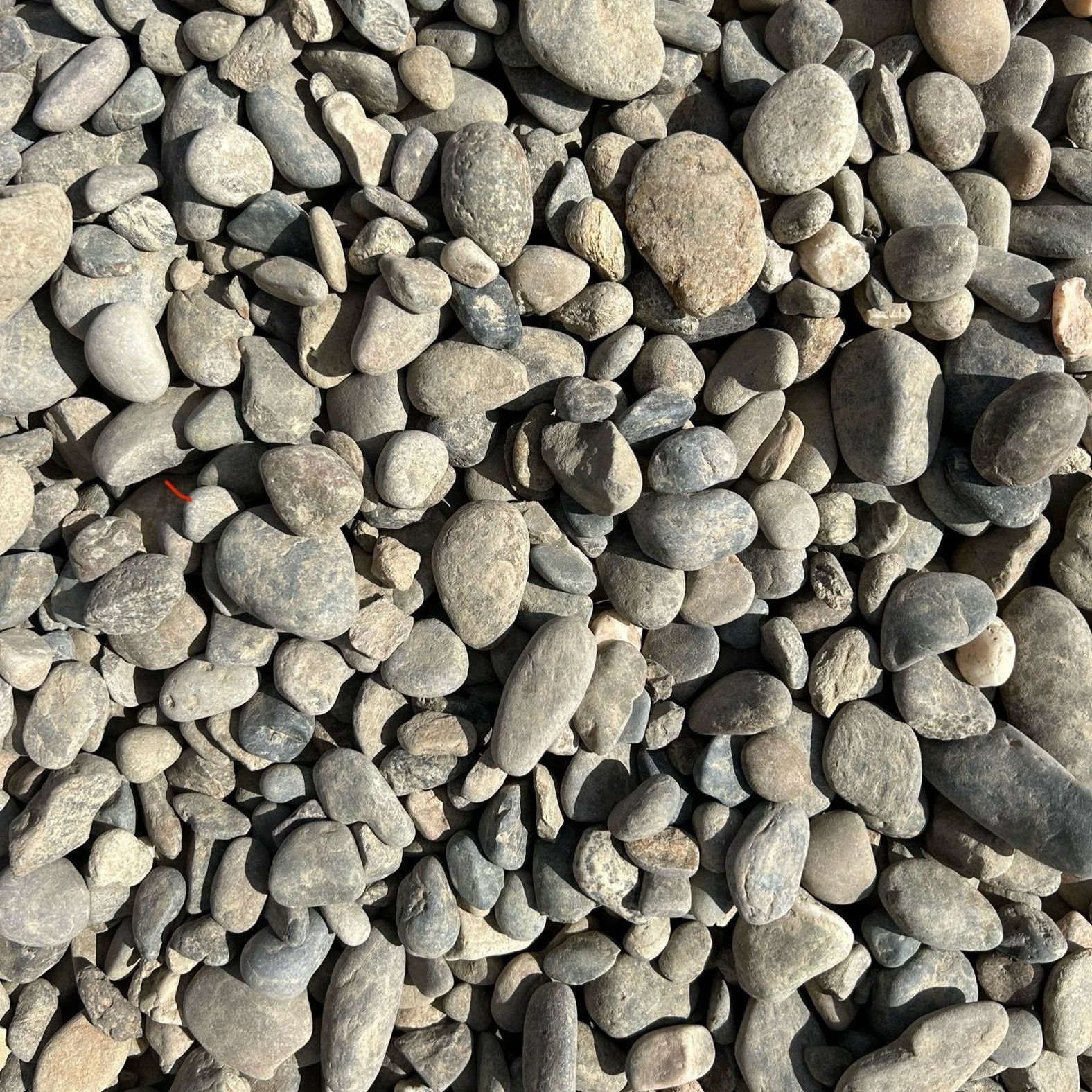 A pile of rocks is sitting on the ground