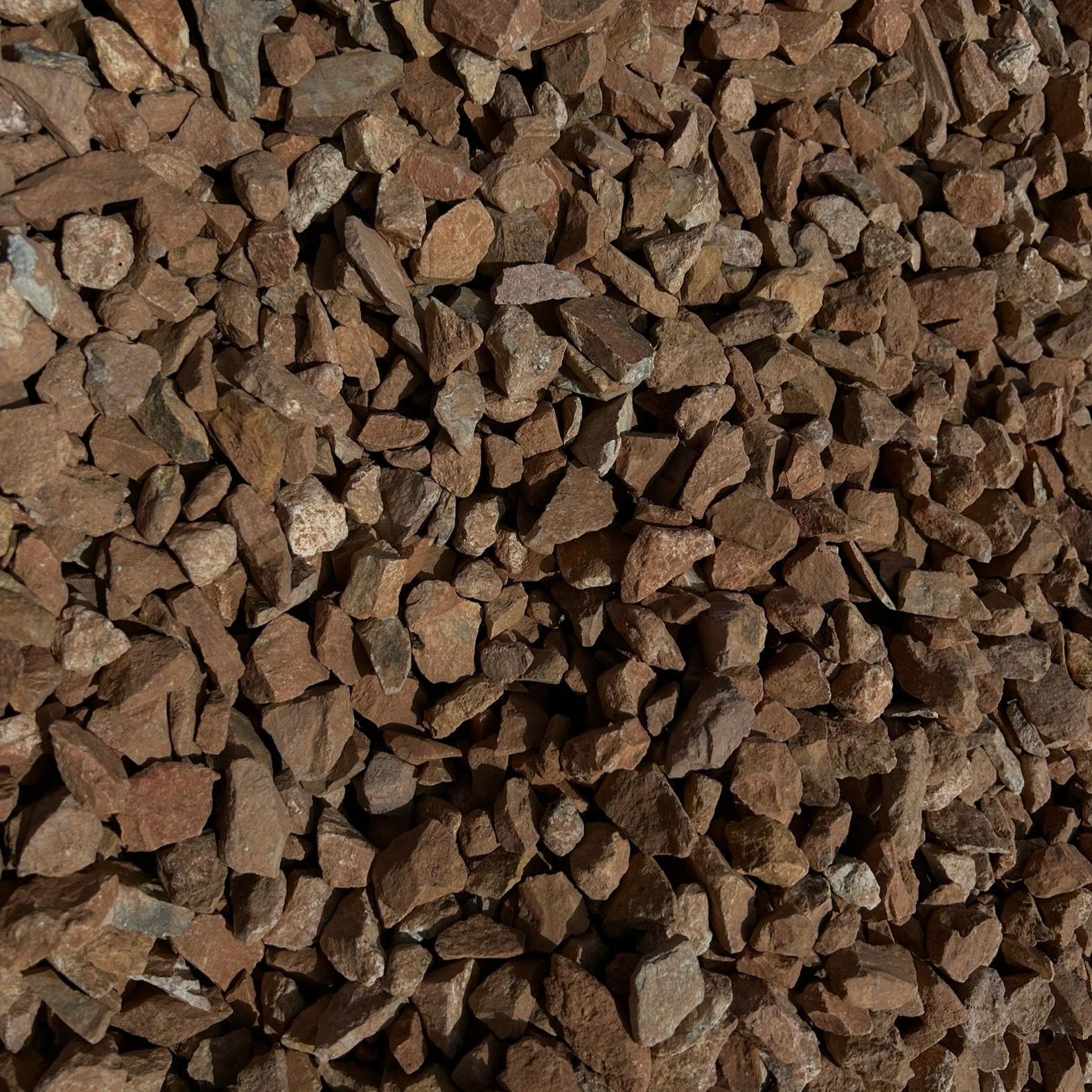 A pile of brown gravel is sitting on the ground