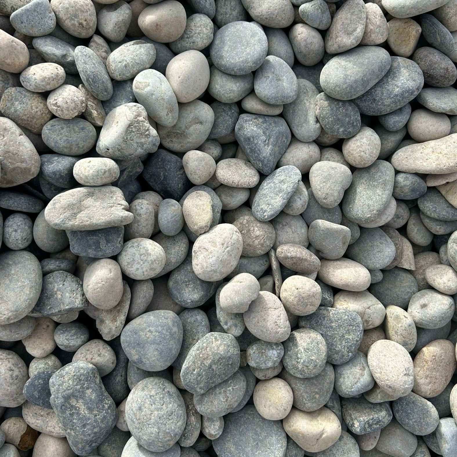 A pile of rocks that are gray and white