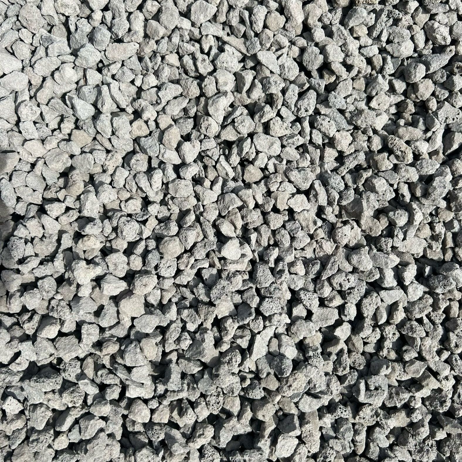 A pile of gravel is sitting on the ground.
