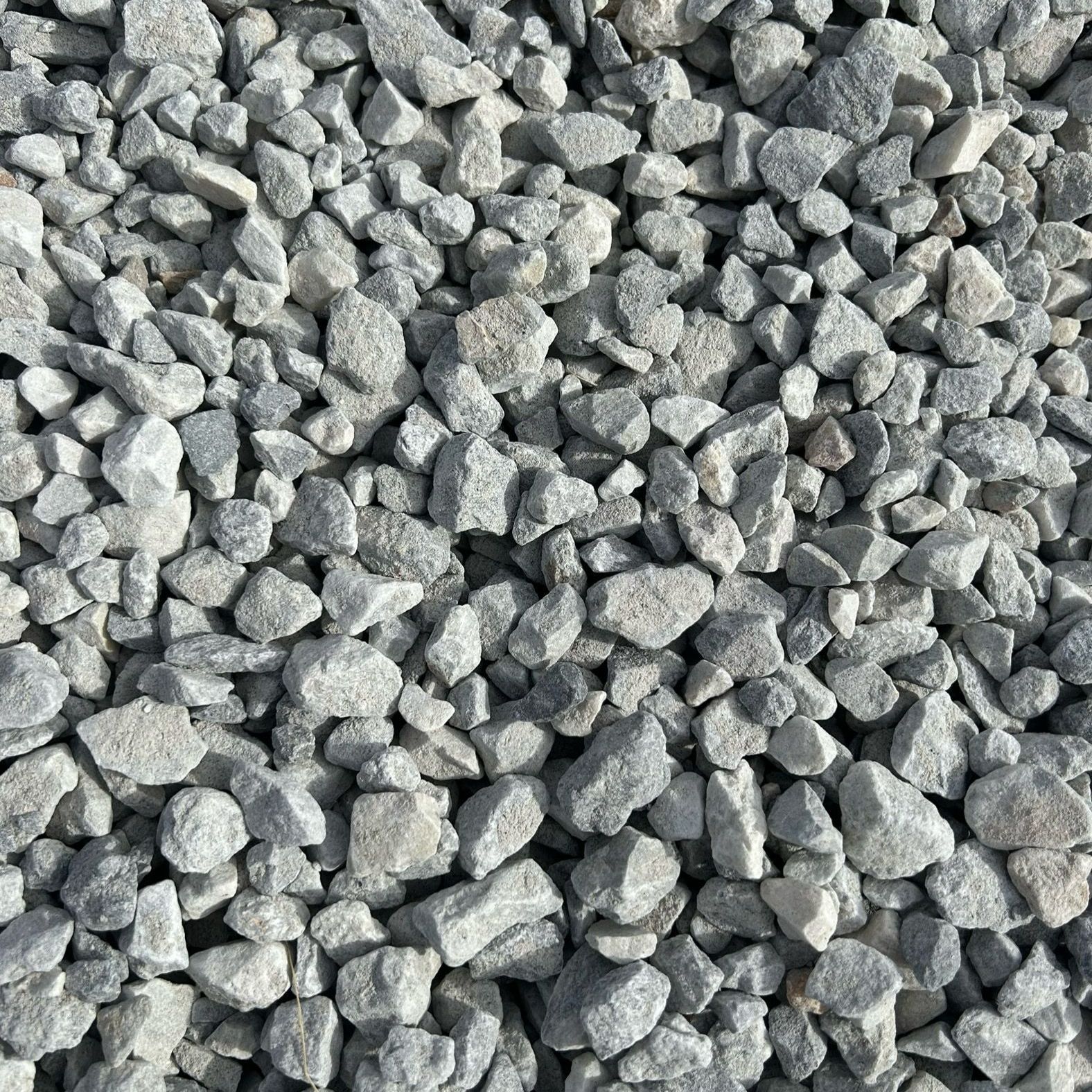 A pile of gravel is sitting on the ground.