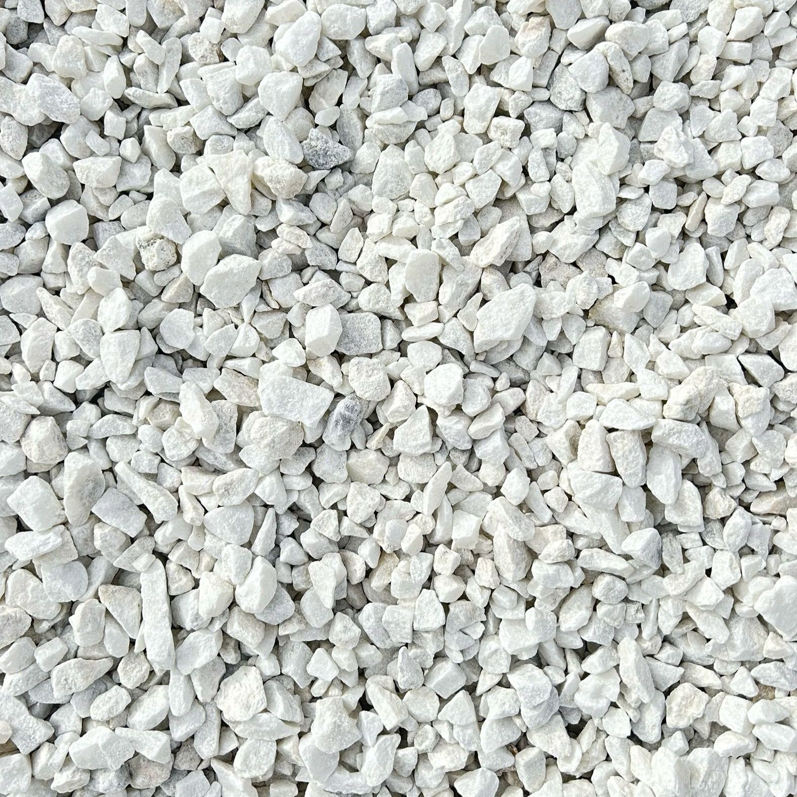 A pile of white gravel is sitting on the ground.