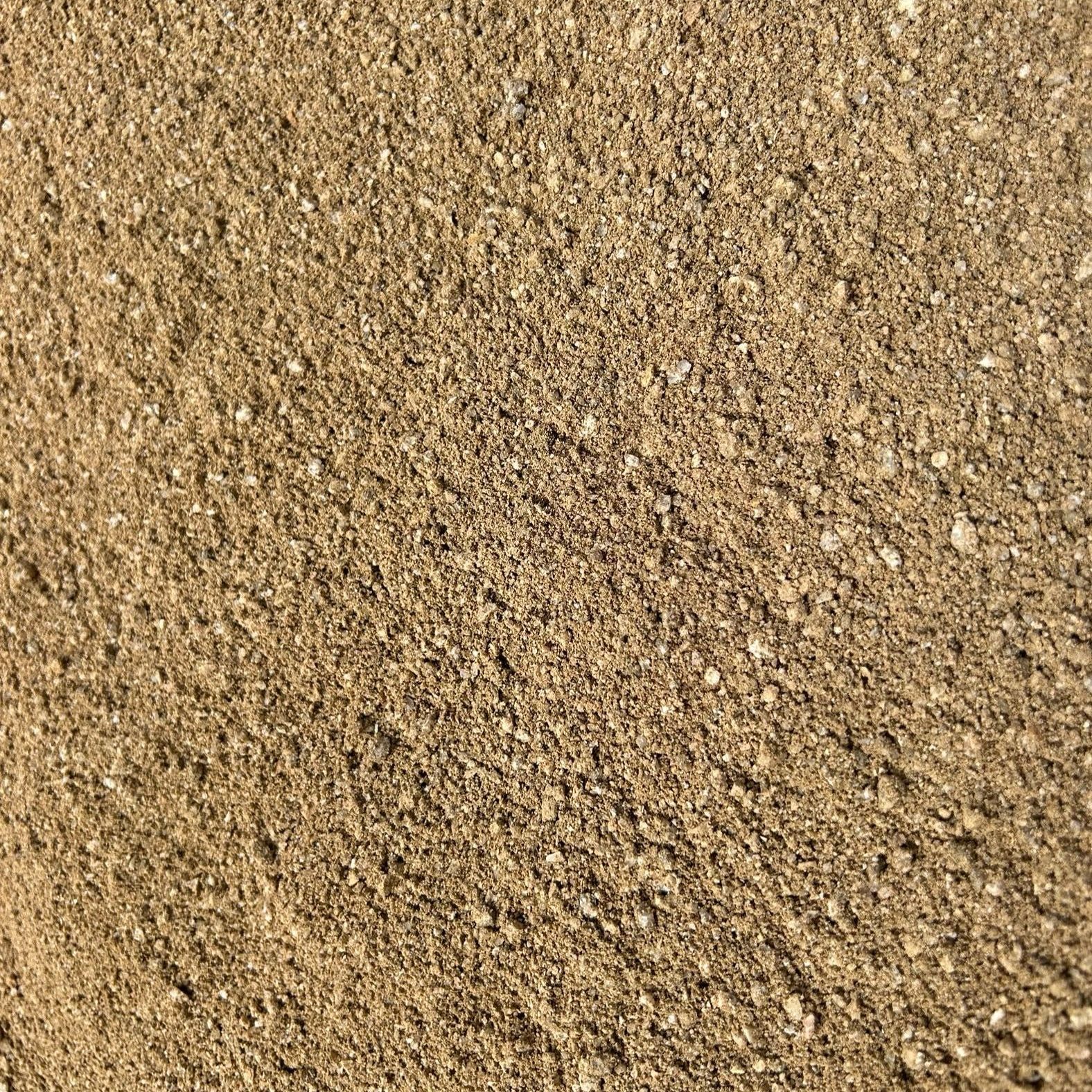 A close up of a pile of brown gravel.