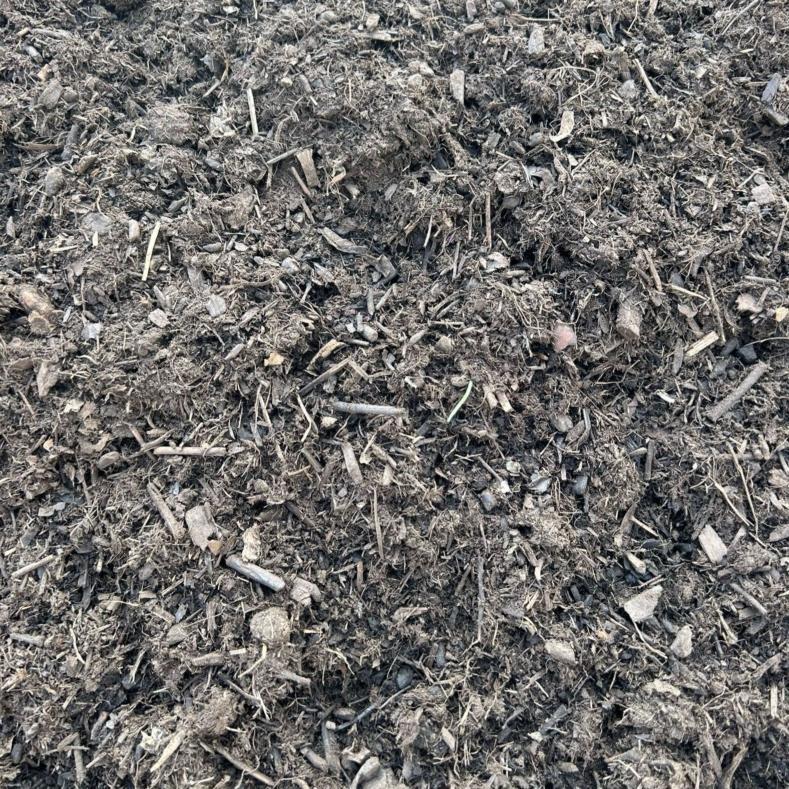 A pile of dirt is sitting on the ground.