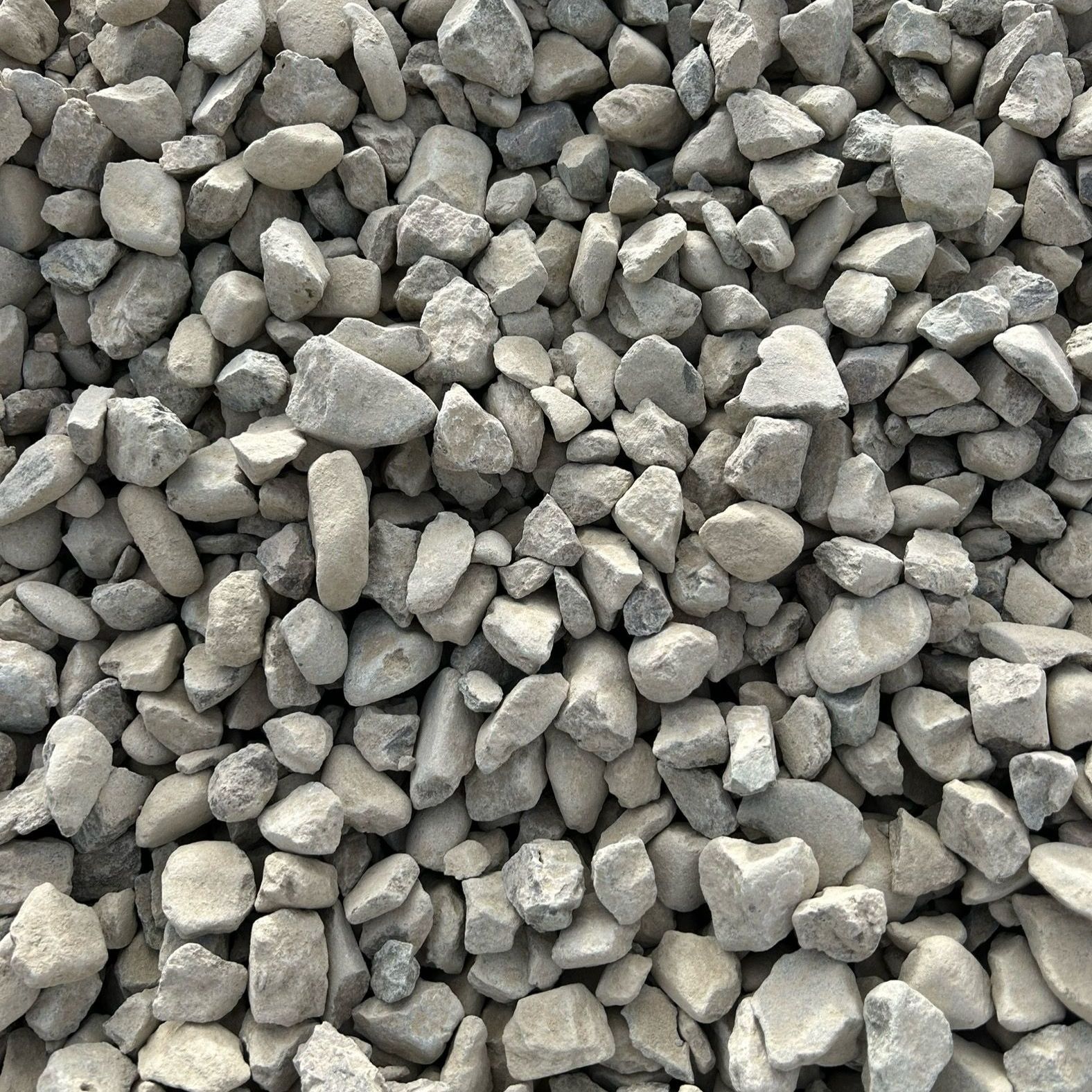 A pile of gravel is sitting on the ground.