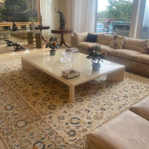 A living room with a couch and a coffee table