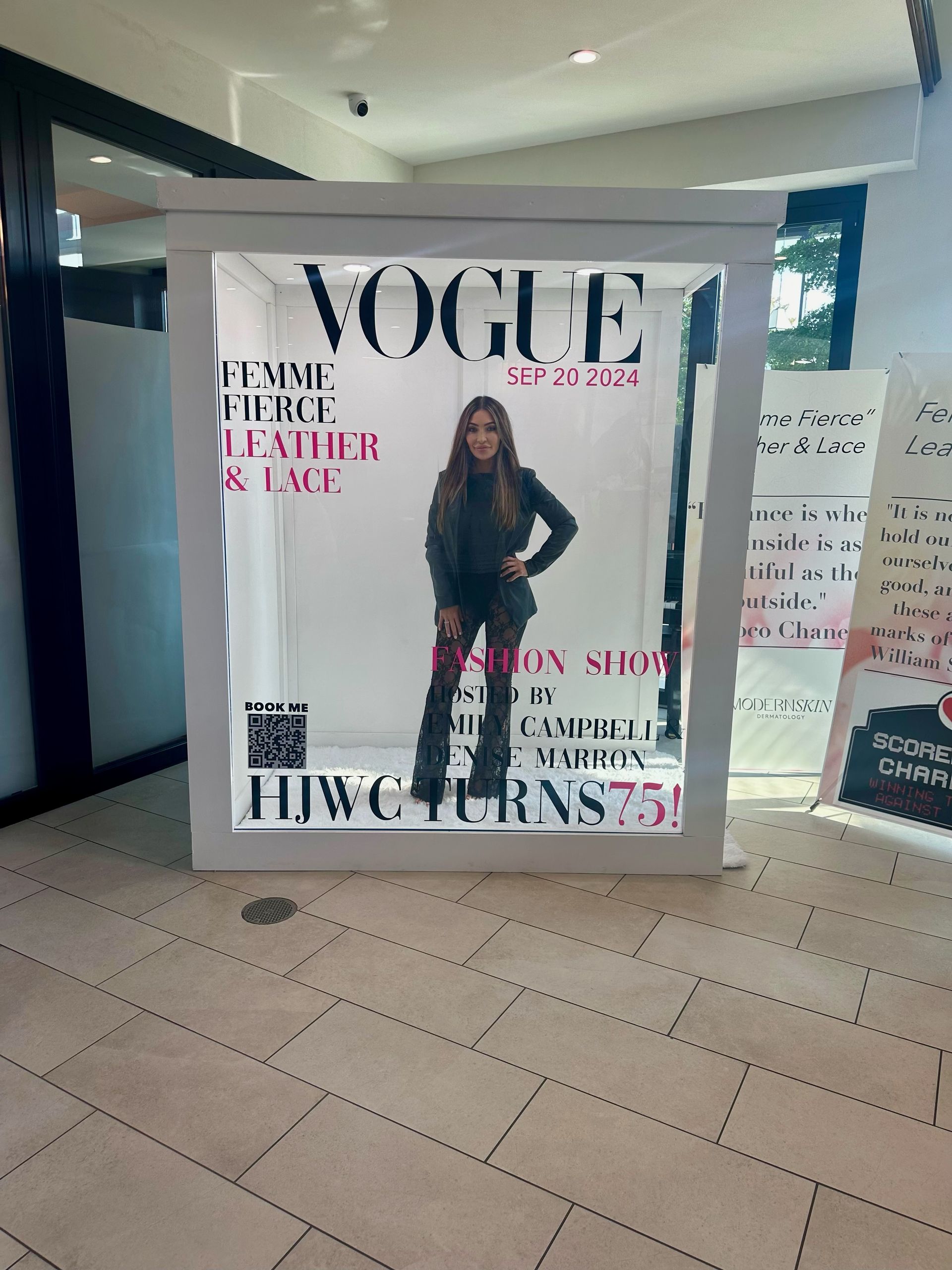 Guests taking pictures in Vogue-inspired photo booth rental