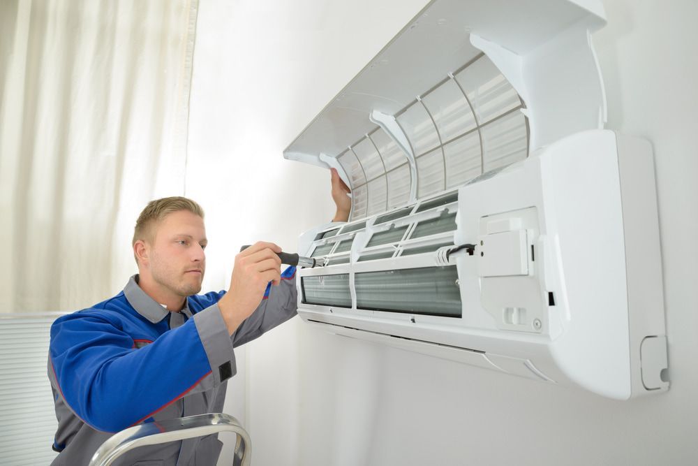 Technician Wearing Safety Hat — Air Conditioning Services in Fairy Meadow, NSW