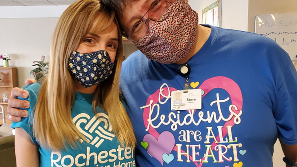 a brick building with green awnings on the front of it