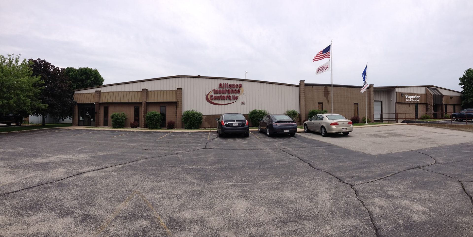 A large building with cars parked in front of it