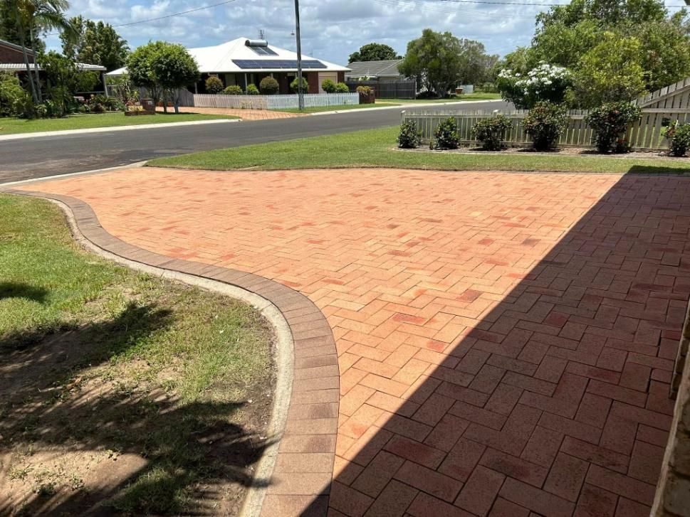 A Clean Brick Driveway After Cleaned by a High Pressure Water — Derek's Dirty Deeds In Howard, QLD
