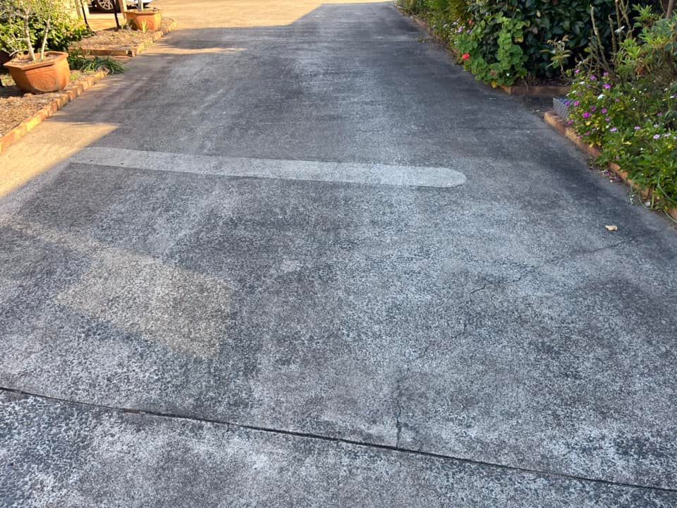 A Clean Concrete Driveway After Cleaned by a High Pressure Water— Derek's Dirty Deeds In Howard, QLD
