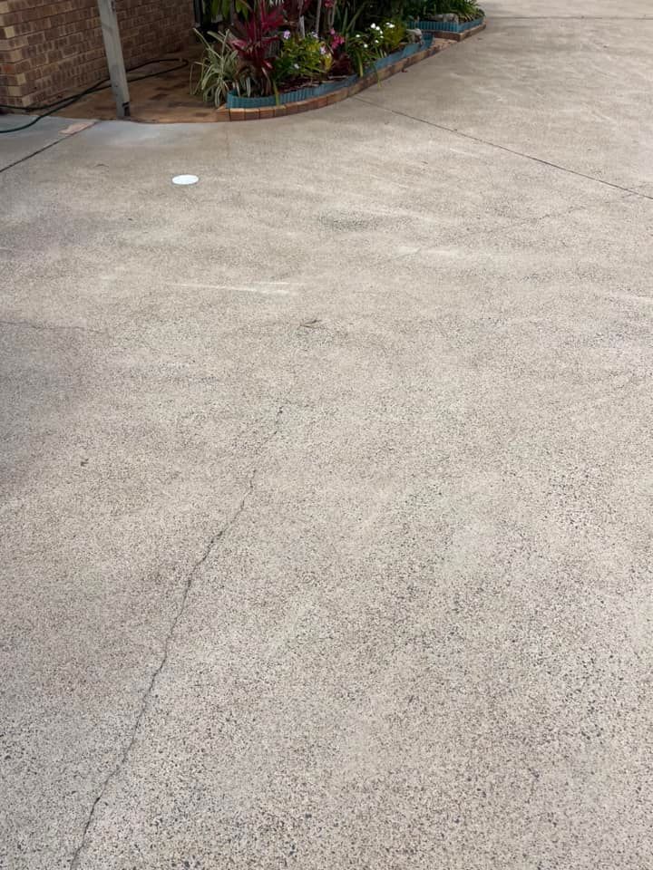 A Concrete Driveway After Cleaned by a High Pressure Water — Derek's Dirty Deeds In Maryborough, QLD