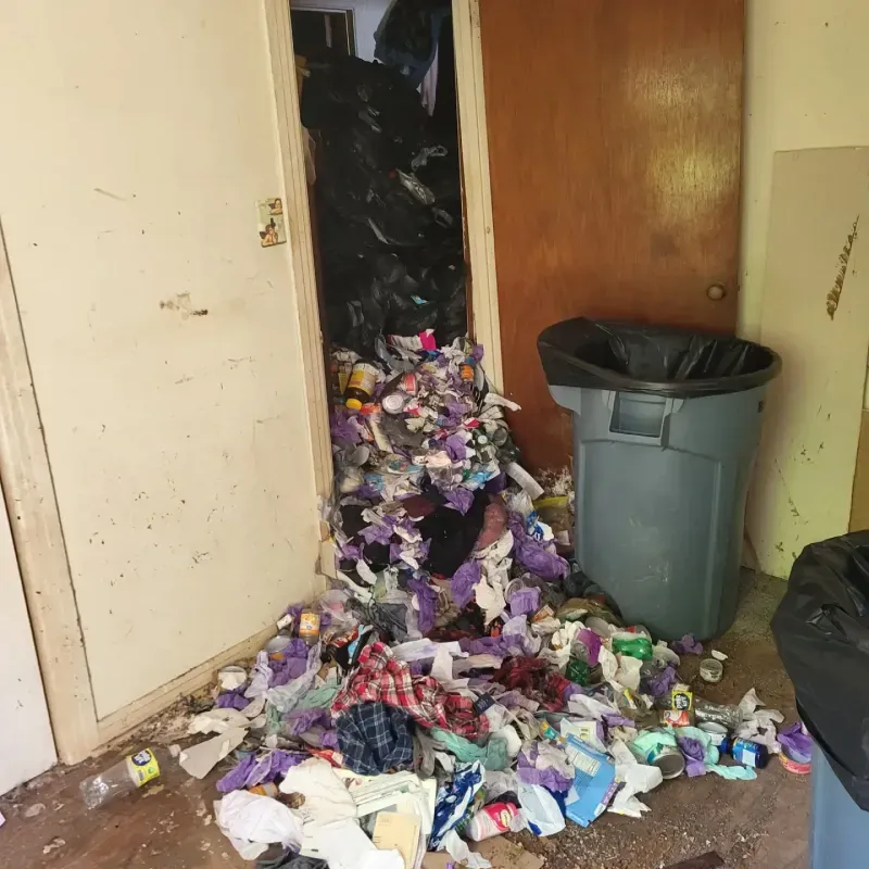 A room filled with trash and a trash can