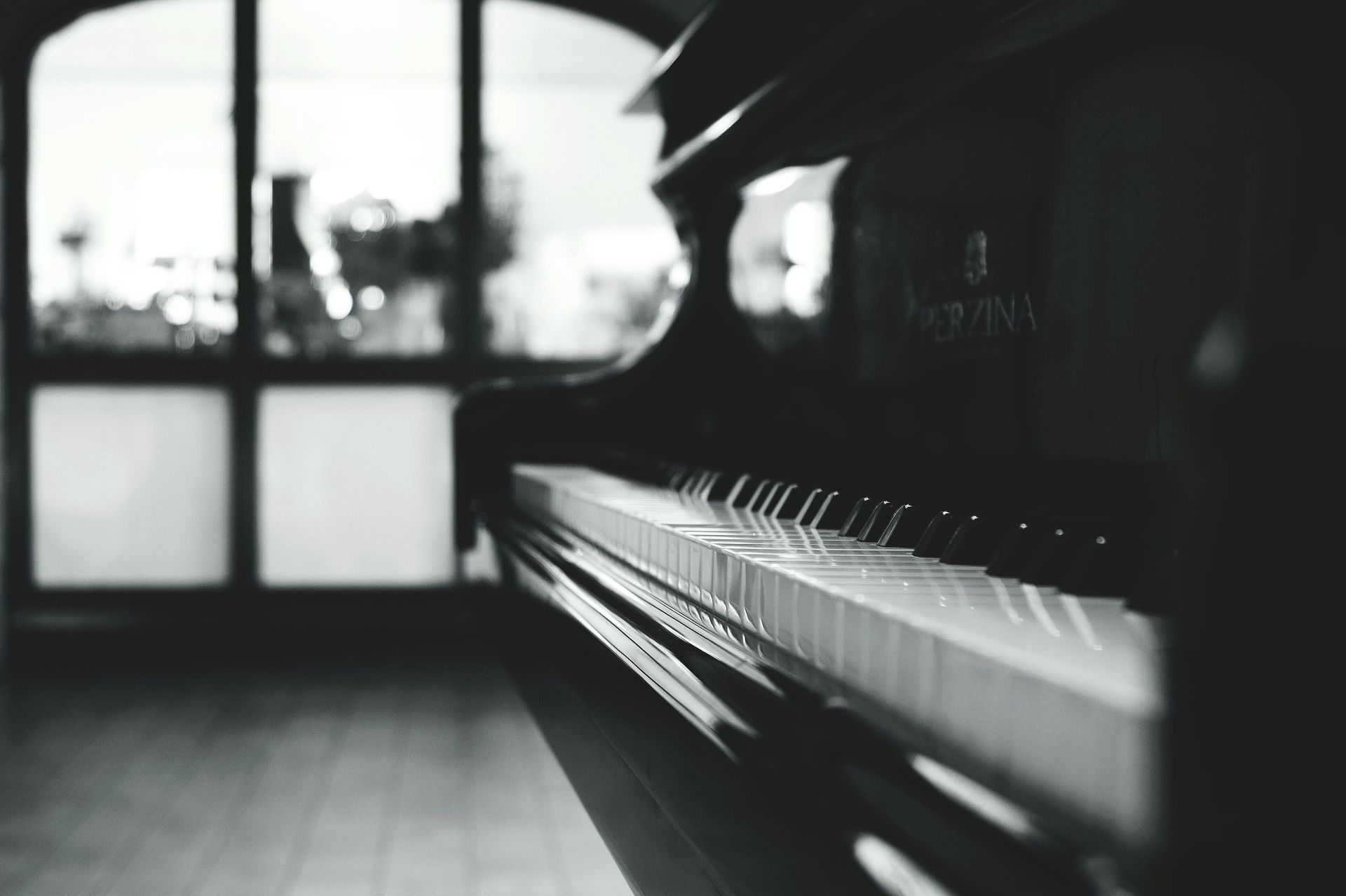 piano as a first instrument, upright piano, black and white