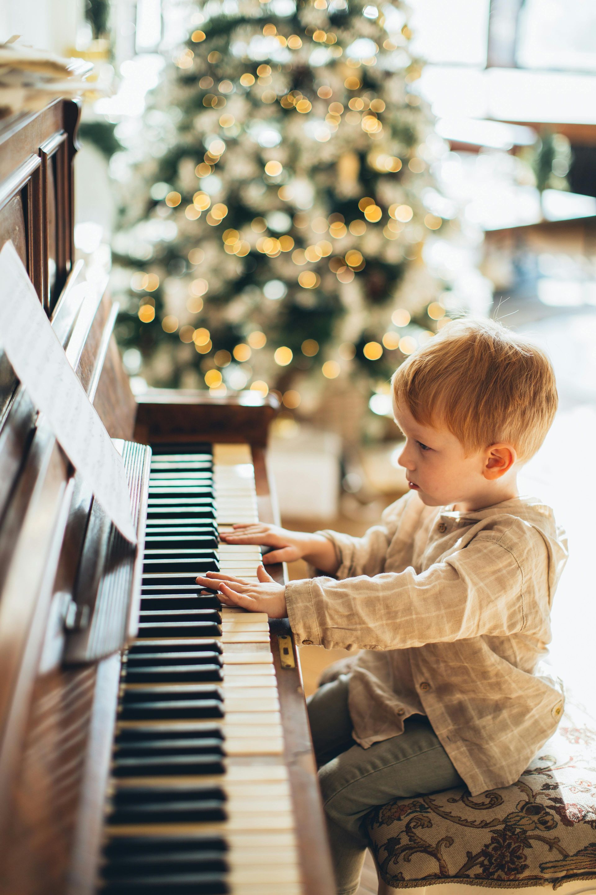 young child playing the piano