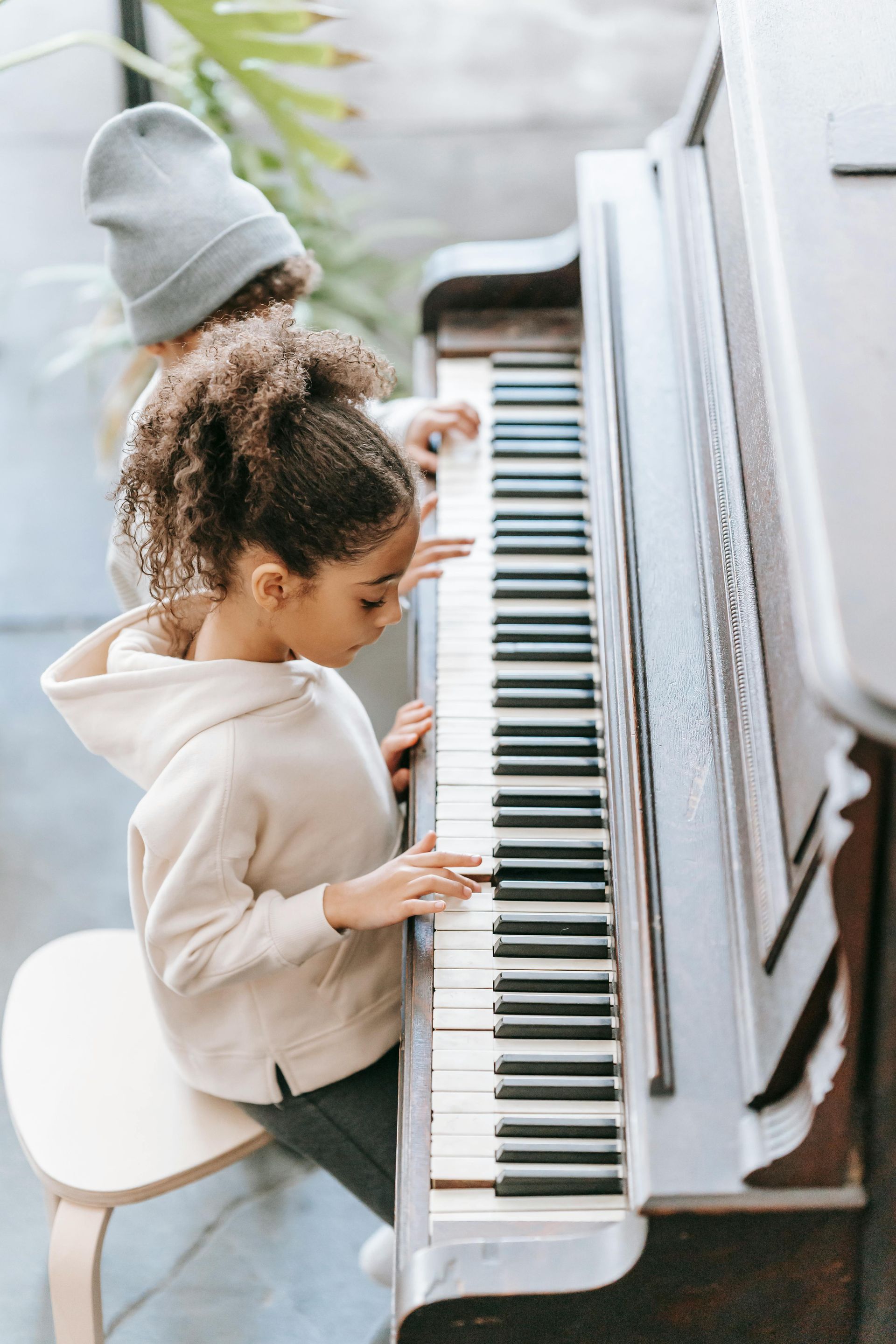 child learning the piano