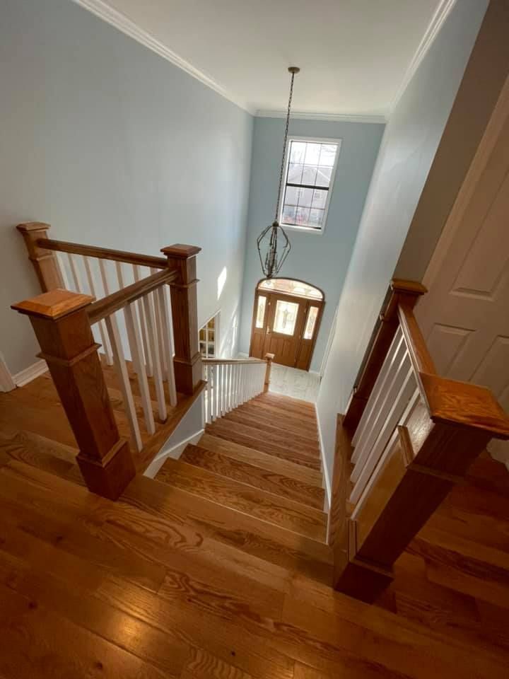 A wooden staircase leading up to the second floor of a house.