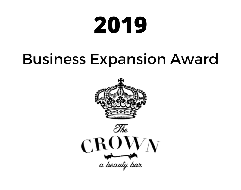 a black and white logo for the crown a beauty bar