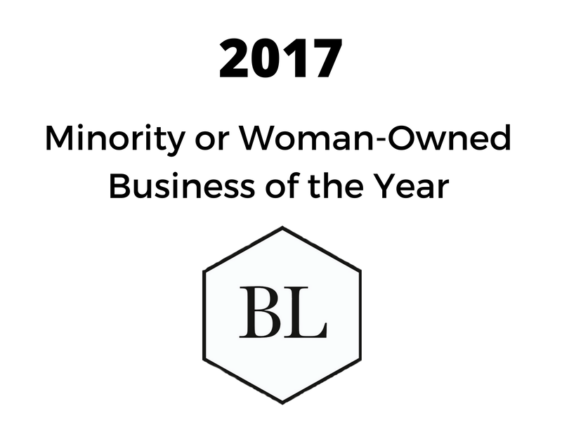 a black and white logo for minority or woman-owned business of the year .