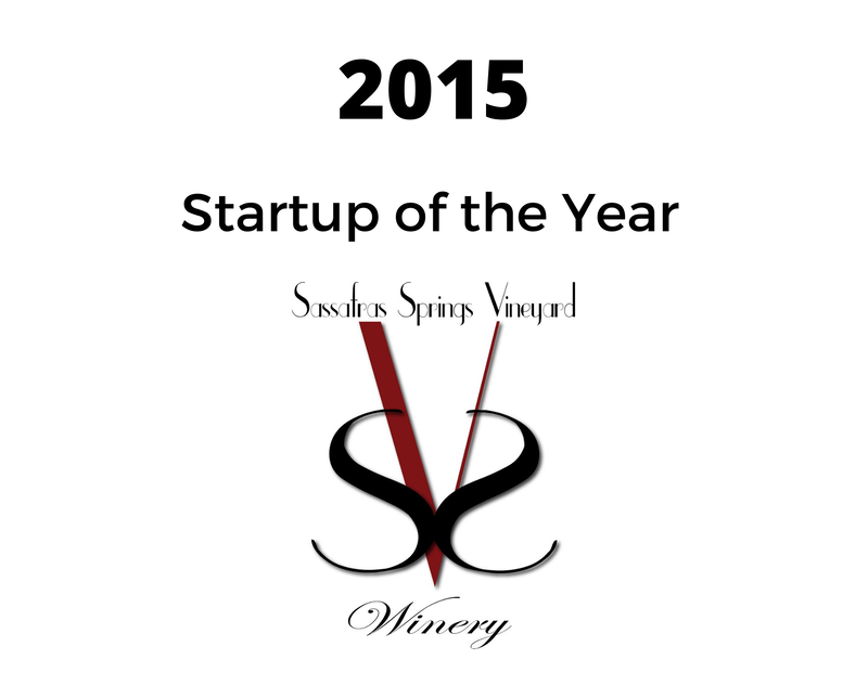 a sign that says 2015 startup of the year on it