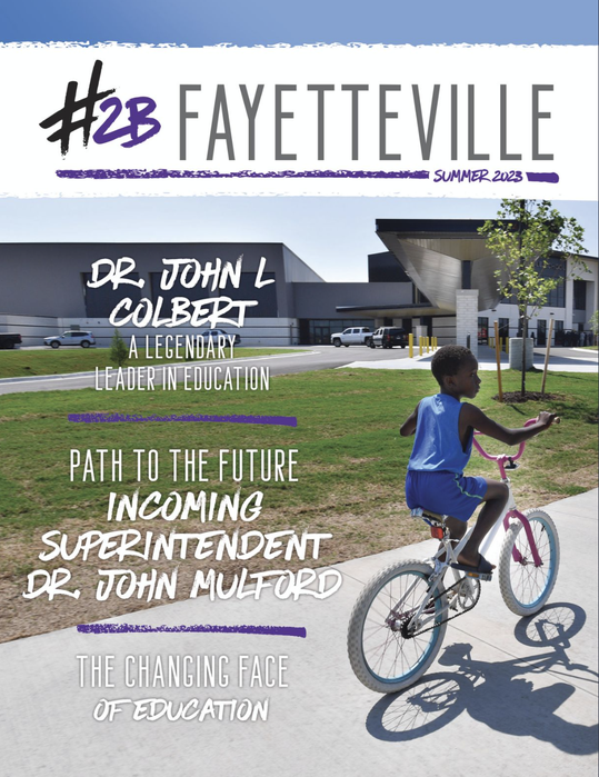 a young boy is riding a bike on the cover of a magazine .