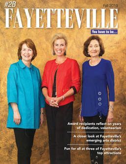 three women are standing next to each other on the cover of a magazine .