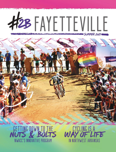 a man is riding a bike on the cover of a magazine .