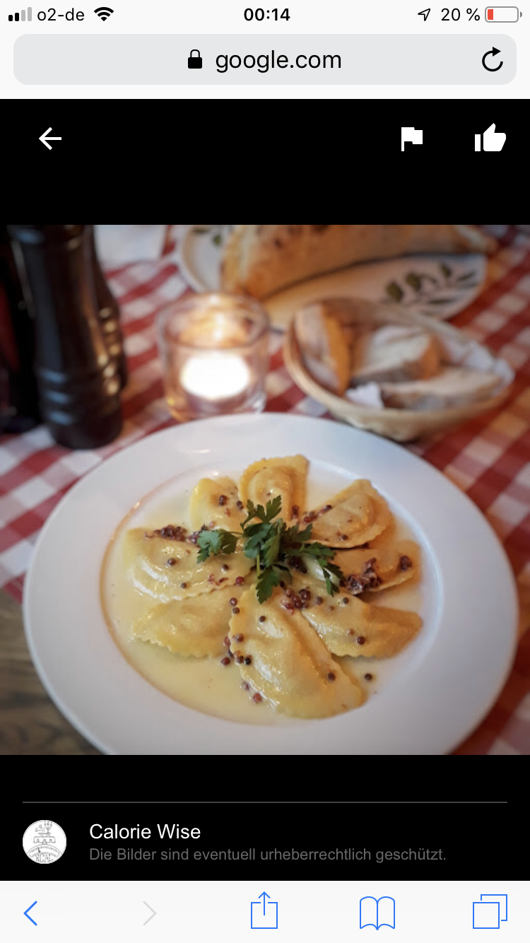Auf einem Telefonbildschirm ist ein Bild von einem Teller mit Essen zu sehen